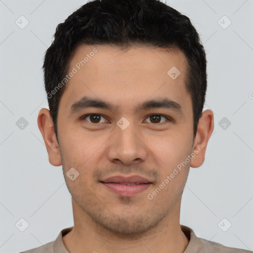 Joyful latino young-adult male with short  brown hair and brown eyes