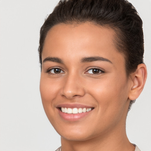 Joyful white young-adult female with short  brown hair and brown eyes