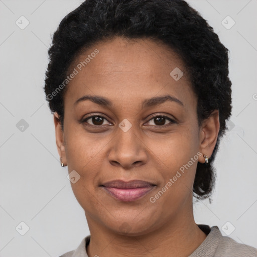 Joyful latino young-adult female with short  black hair and brown eyes