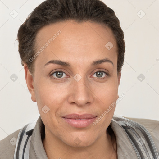 Joyful white adult female with short  brown hair and grey eyes