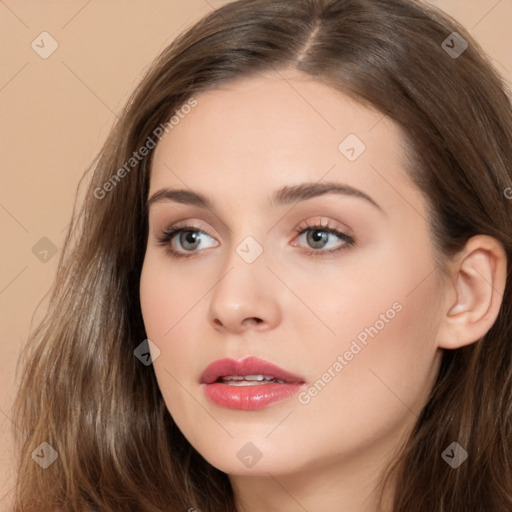 Neutral white young-adult female with long  brown hair and brown eyes