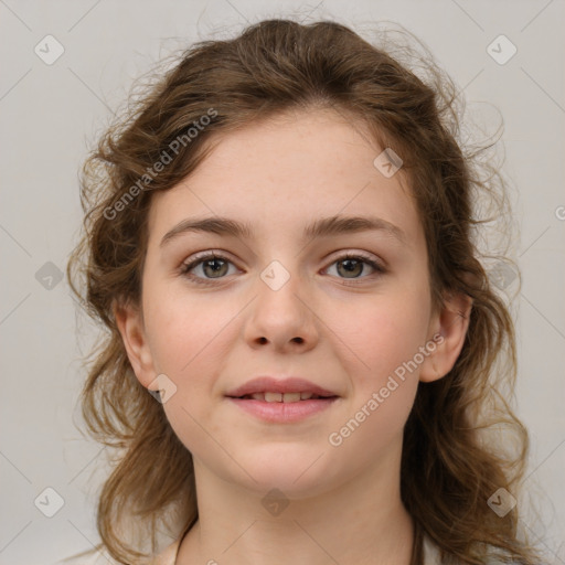 Joyful white child female with medium  brown hair and brown eyes