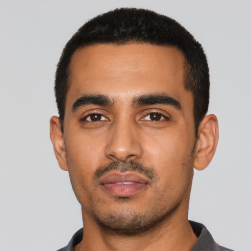 Neutral latino young-adult male with short  black hair and brown eyes
