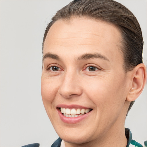 Joyful white young-adult female with short  brown hair and brown eyes