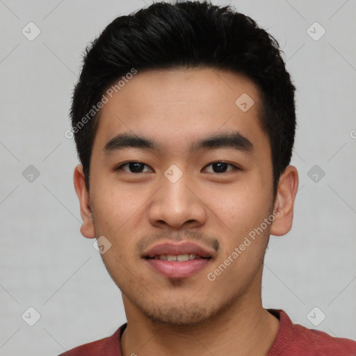 Joyful asian young-adult male with short  black hair and brown eyes