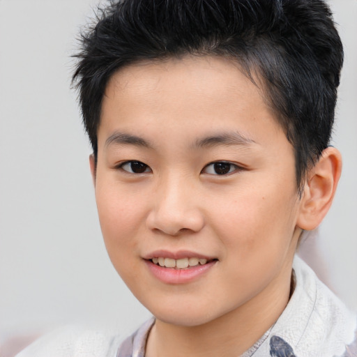 Joyful asian child female with short  brown hair and brown eyes