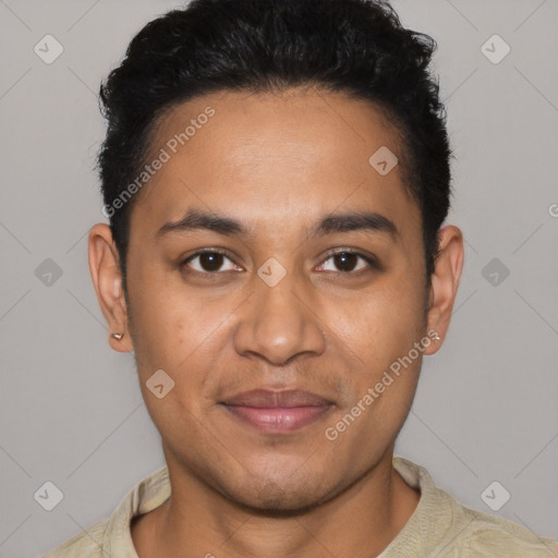 Joyful latino young-adult male with short  brown hair and brown eyes