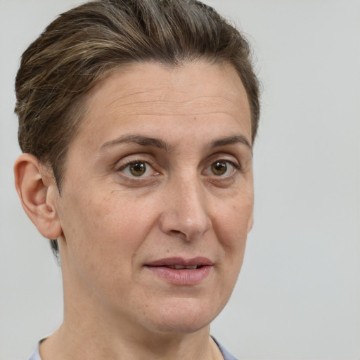 Joyful white adult female with short  brown hair and grey eyes