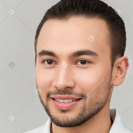 Joyful white young-adult male with short  brown hair and brown eyes