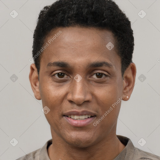 Joyful black young-adult male with short  black hair and brown eyes