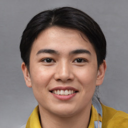 Joyful asian young-adult male with short  brown hair and brown eyes