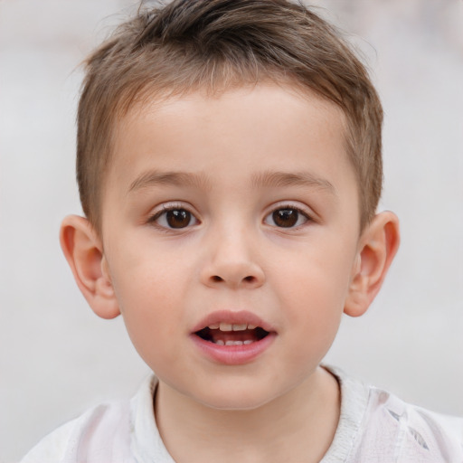 Joyful white child male with short  brown hair and brown eyes