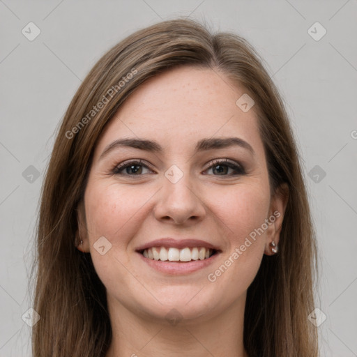 Joyful white young-adult female with long  brown hair and grey eyes