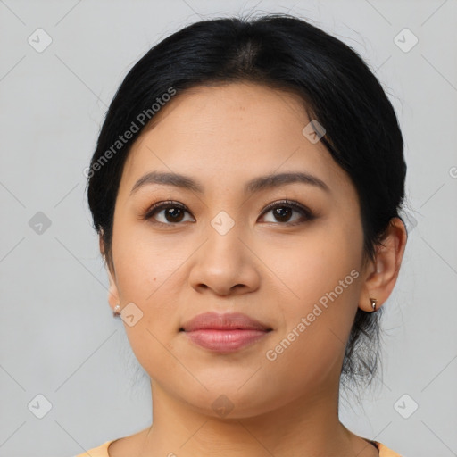 Joyful latino young-adult female with medium  black hair and brown eyes