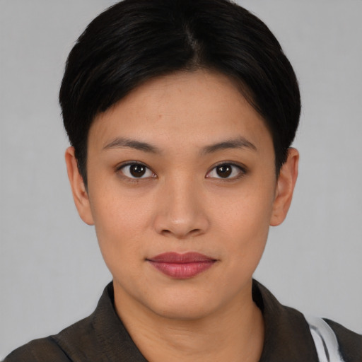 Joyful asian young-adult female with short  black hair and brown eyes