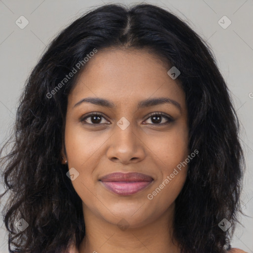 Joyful black young-adult female with long  brown hair and brown eyes