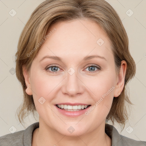 Joyful white young-adult female with medium  brown hair and blue eyes