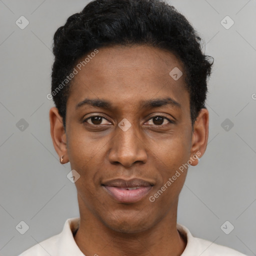 Joyful black young-adult male with short  black hair and brown eyes