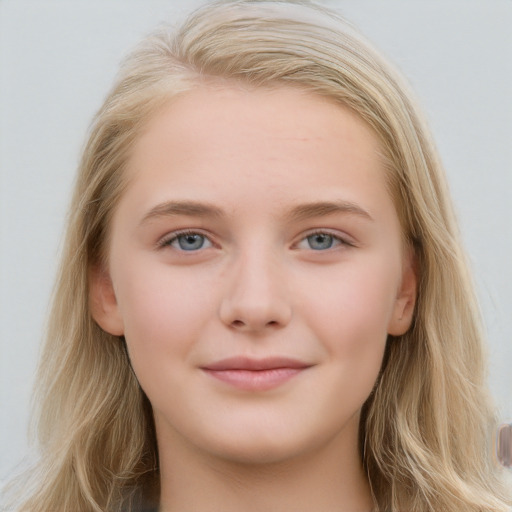 Joyful white young-adult female with long  brown hair and blue eyes