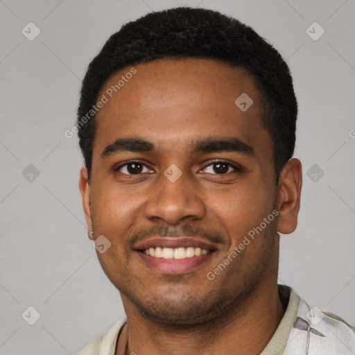 Joyful black young-adult male with short  black hair and brown eyes