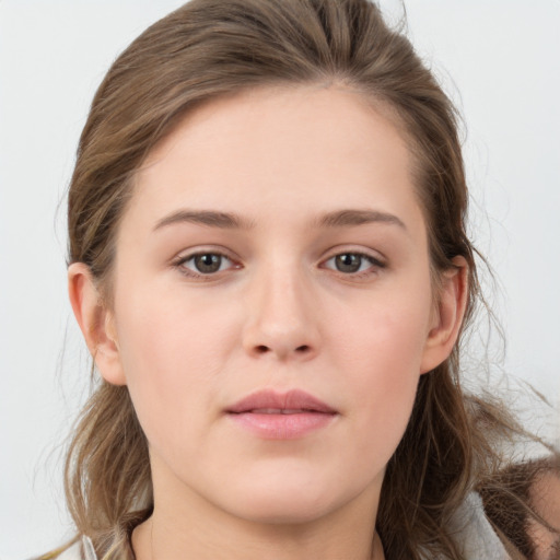 Neutral white young-adult female with long  brown hair and grey eyes