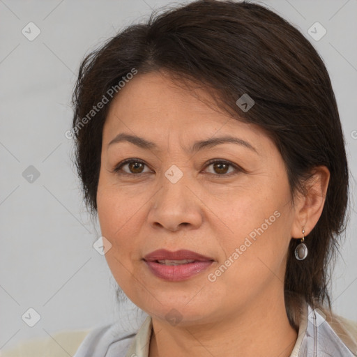 Joyful white adult female with medium  brown hair and brown eyes