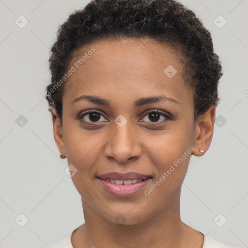 Joyful black young-adult female with short  brown hair and brown eyes