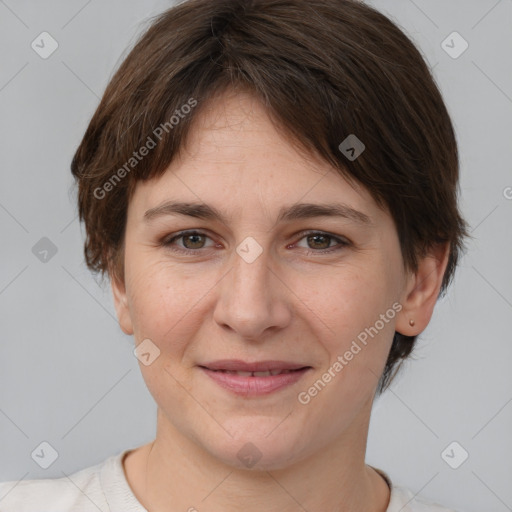 Joyful white young-adult female with medium  brown hair and brown eyes