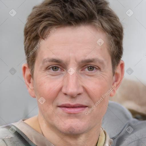 Joyful white adult male with short  brown hair and grey eyes