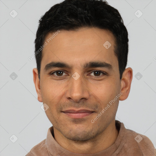 Joyful latino young-adult male with short  black hair and brown eyes