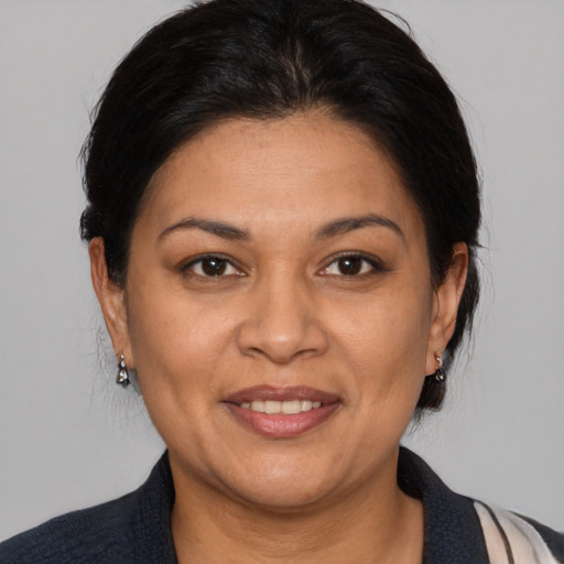Joyful white adult female with medium  brown hair and brown eyes