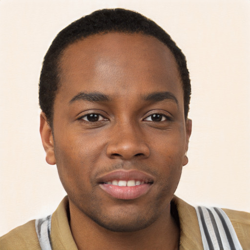 Joyful black young-adult male with short  brown hair and brown eyes