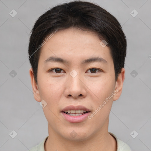 Joyful asian young-adult male with short  brown hair and brown eyes