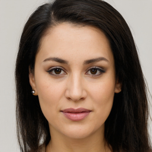 Joyful white young-adult female with long  brown hair and brown eyes