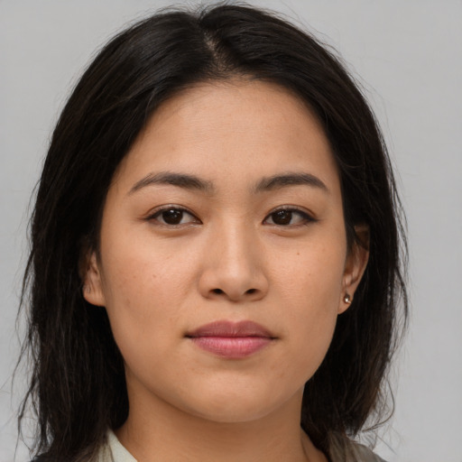 Joyful asian young-adult female with medium  brown hair and brown eyes