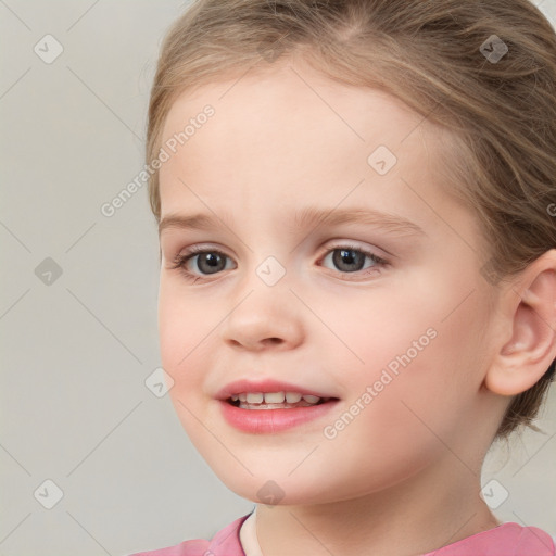 Joyful white child female with medium  brown hair and blue eyes