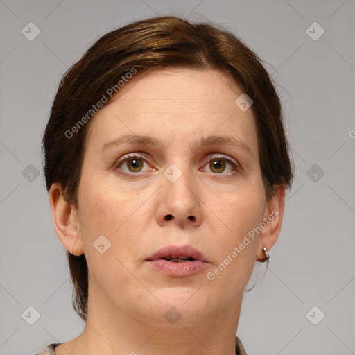 Joyful white adult female with short  brown hair and grey eyes