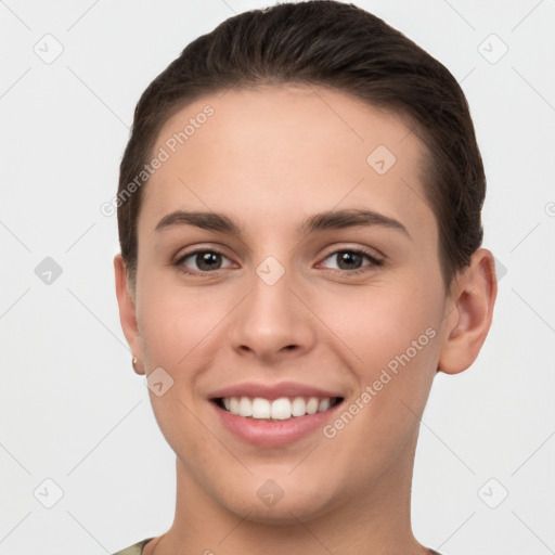 Joyful white young-adult female with short  brown hair and brown eyes