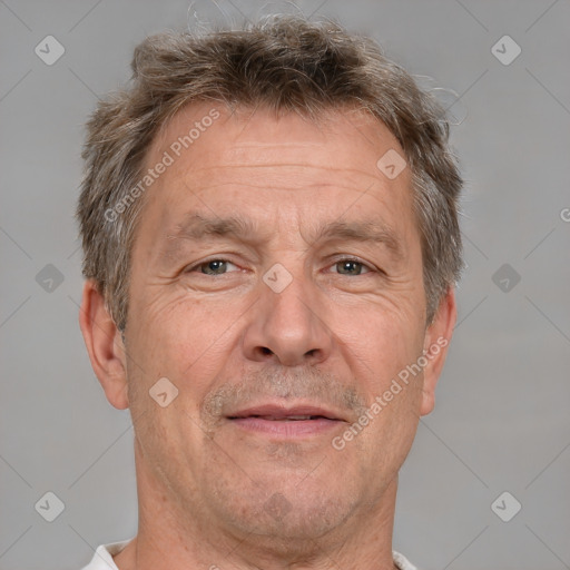 Joyful white middle-aged male with short  brown hair and brown eyes