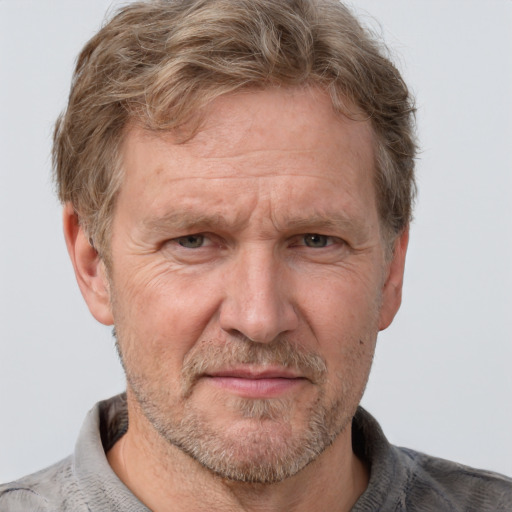 Joyful white middle-aged male with short  brown hair and grey eyes