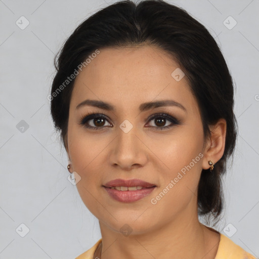 Joyful latino young-adult female with medium  brown hair and brown eyes