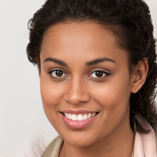 Joyful white young-adult female with long  brown hair and brown eyes