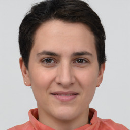 Joyful white young-adult female with short  brown hair and brown eyes