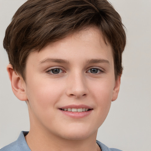 Joyful white child male with short  brown hair and brown eyes