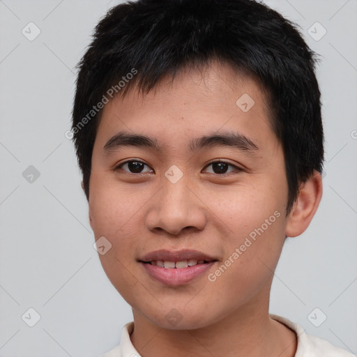 Joyful asian young-adult male with short  black hair and brown eyes