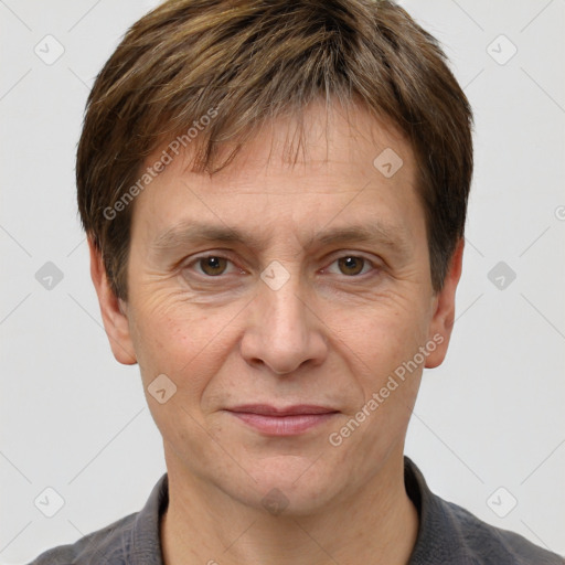 Joyful white adult male with short  brown hair and grey eyes