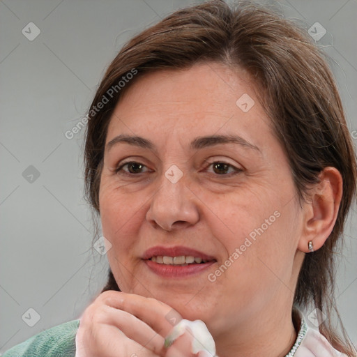 Joyful white adult female with medium  brown hair and brown eyes