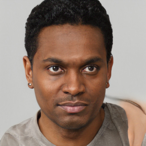 Neutral black young-adult male with short  black hair and brown eyes