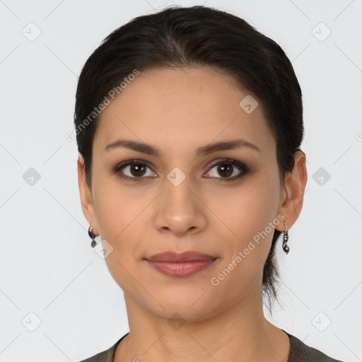 Joyful latino young-adult female with short  brown hair and brown eyes