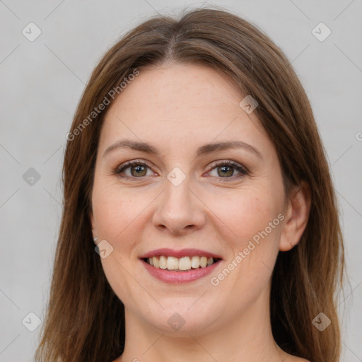 Joyful white young-adult female with long  brown hair and grey eyes